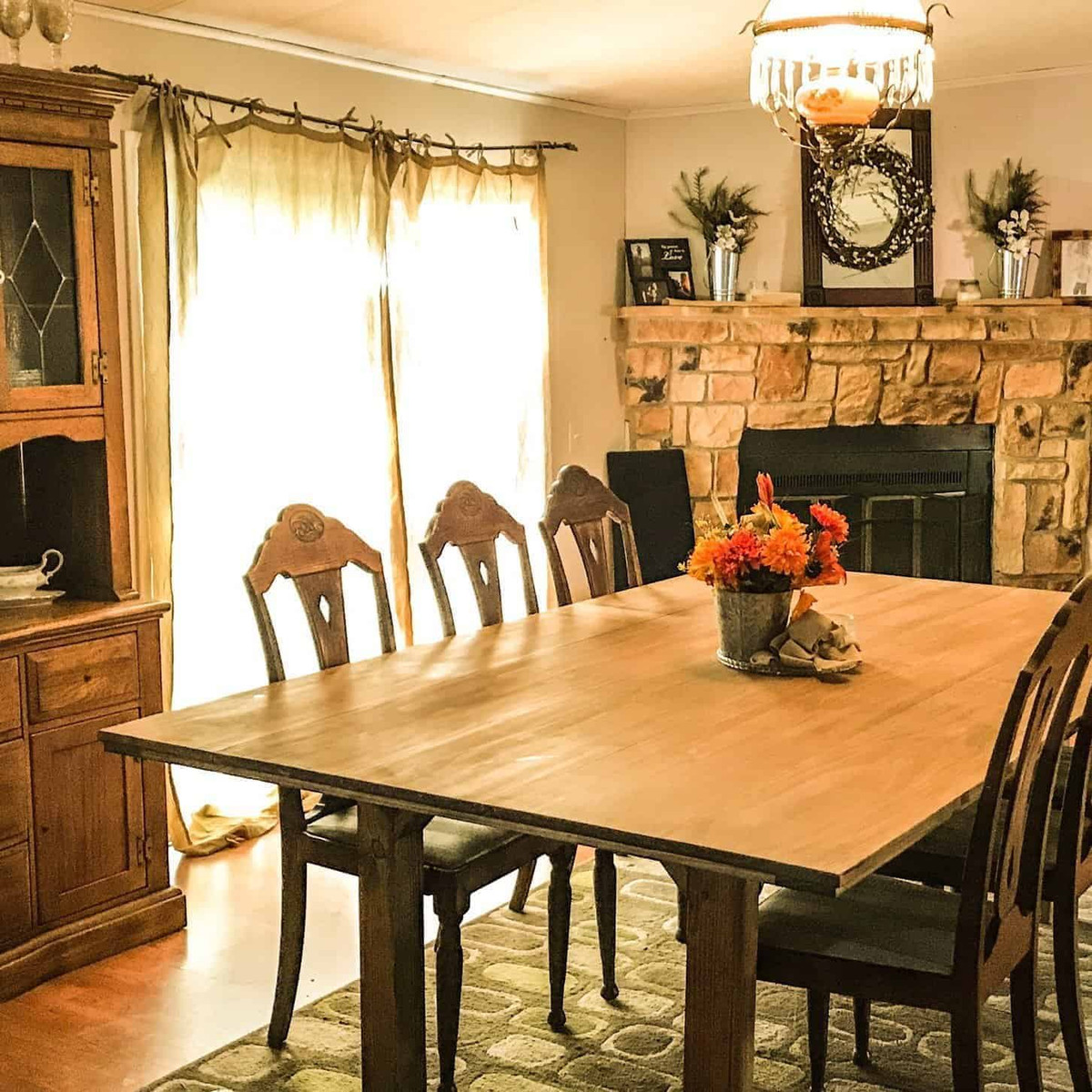 Dining room with fireplace in the background