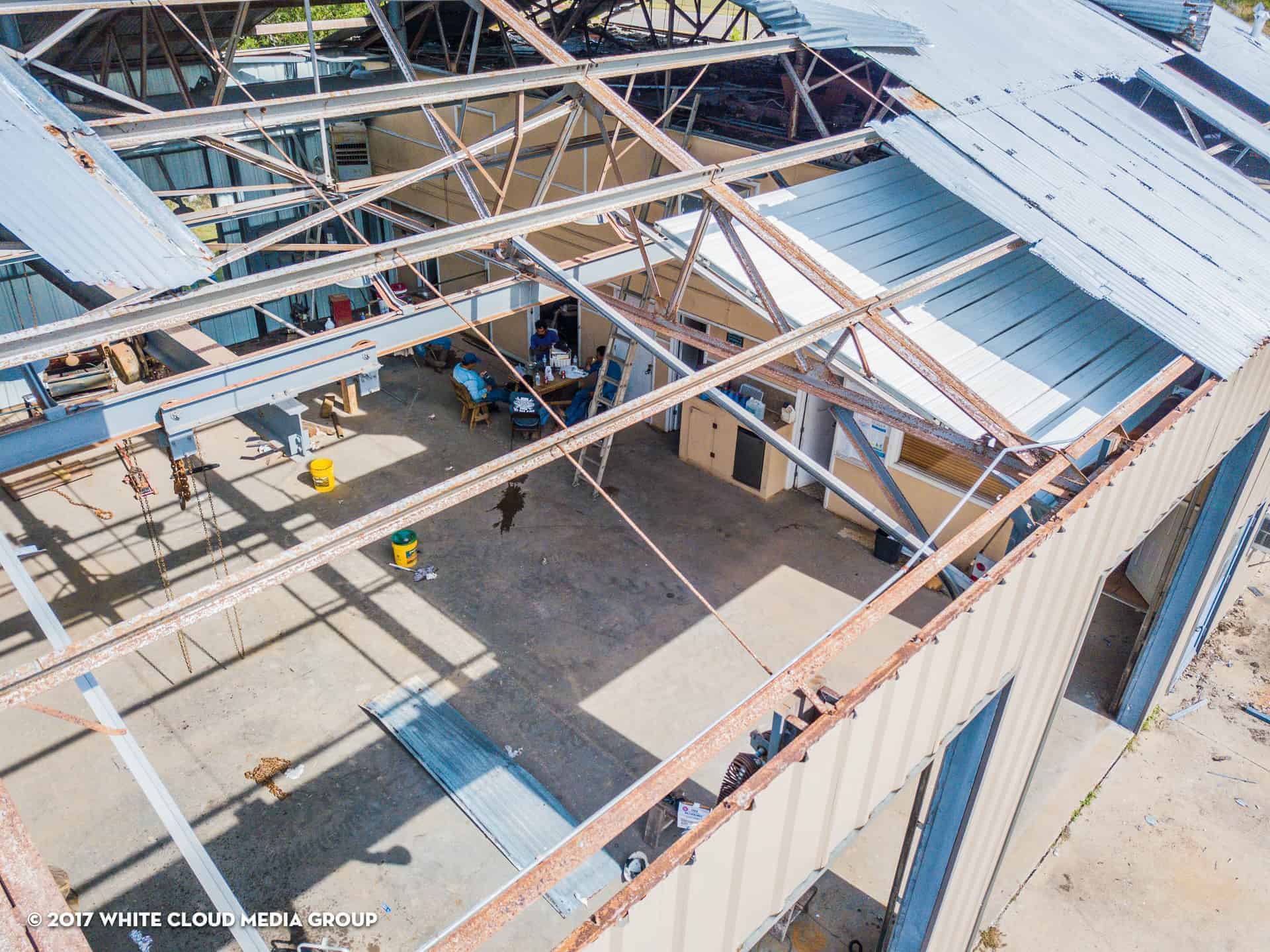 Top view of business damaged by hurricane Katrina with most of the roof missing