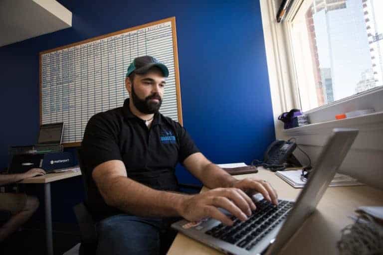 Alberto Piña working at his office in Geekdom