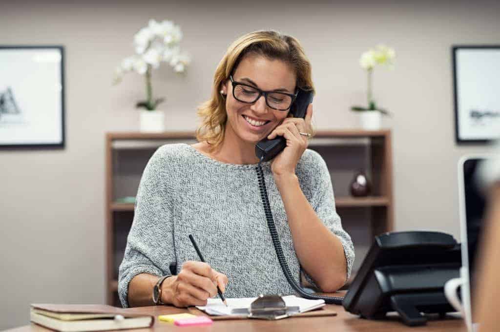 Woman at a desk talking on the phone