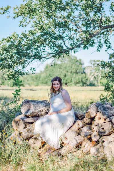 Rachel sitting on logs