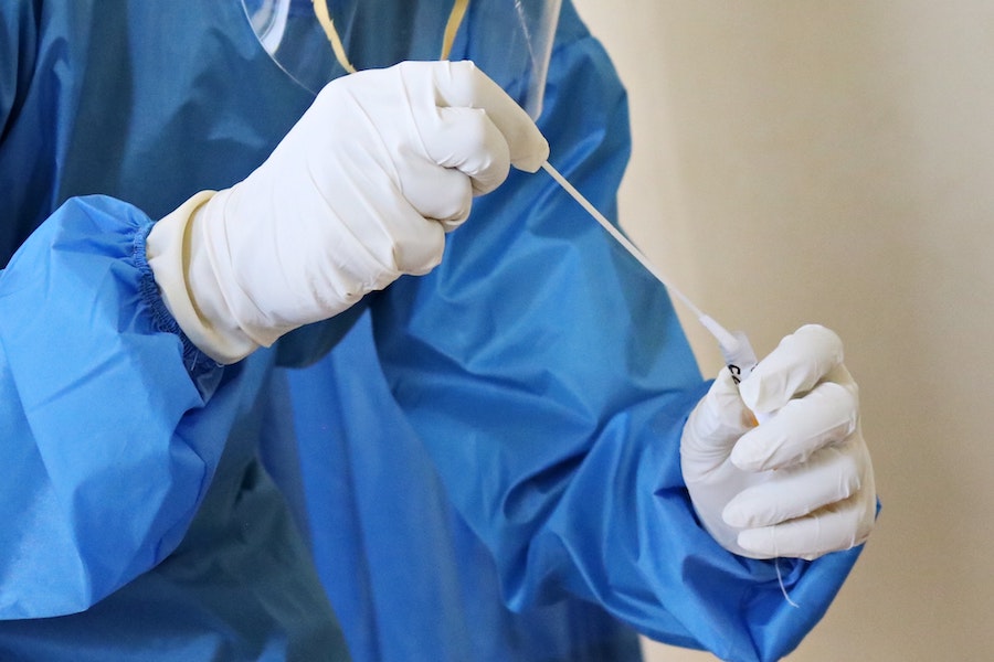 Medical Worker administering swab test