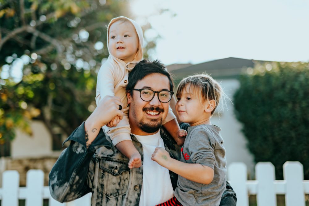 A latin man with his 2 kids