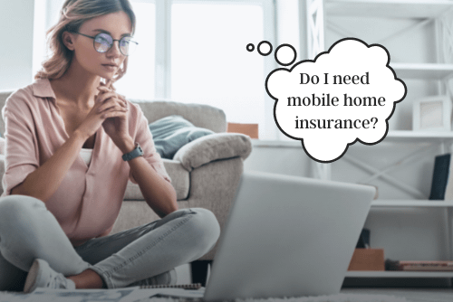 woman sitting at laptop wondering if she needs mobile home insurance