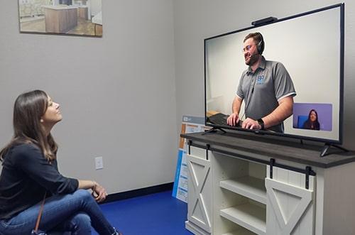 Client talking to sales rep remotely at Braustin Homes dealership